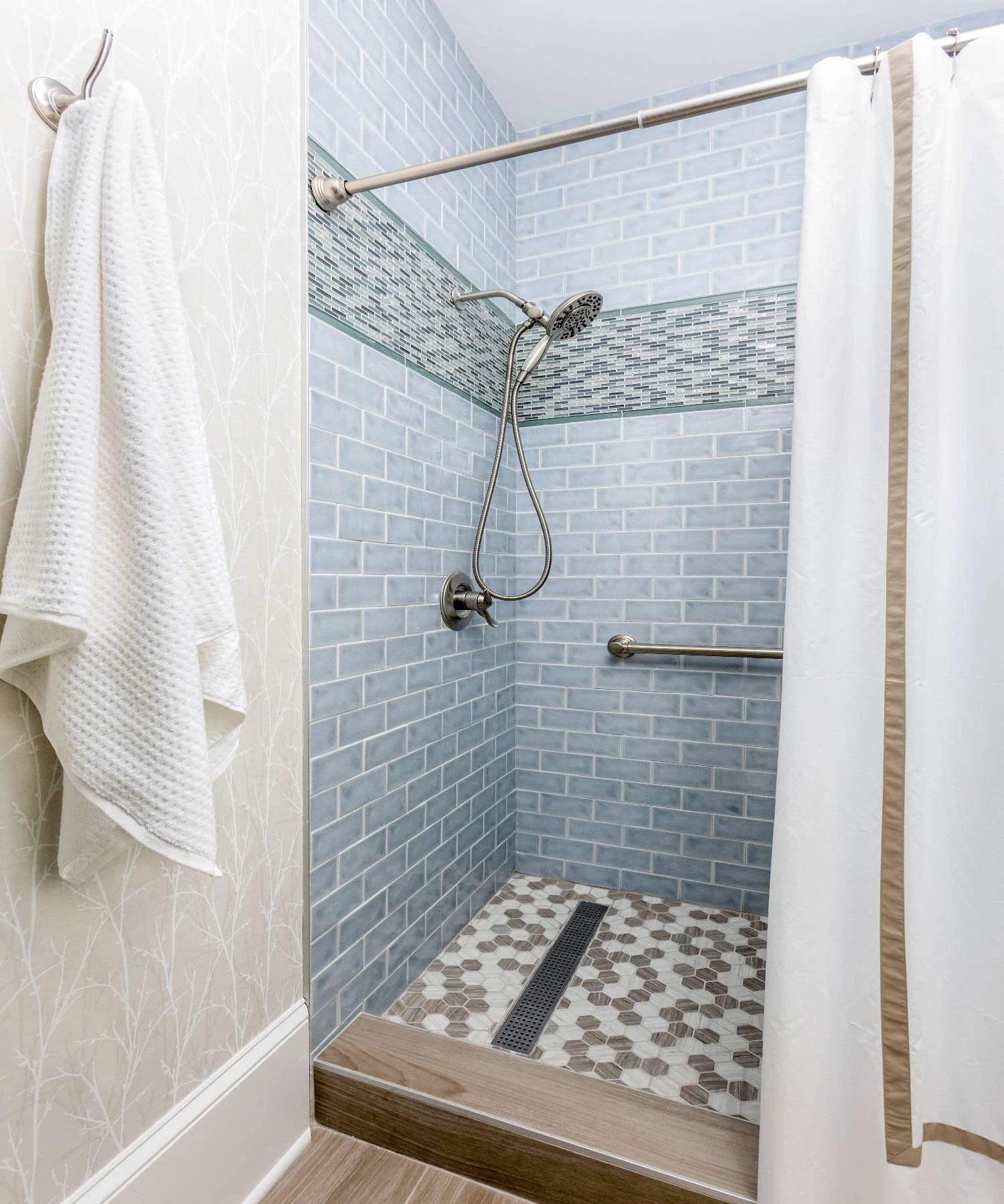 A shower designed with three kinds of tile for color and textural interest.